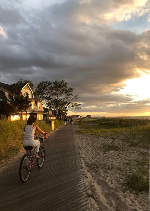 Girl Riding Bike at Sunset Fire Island